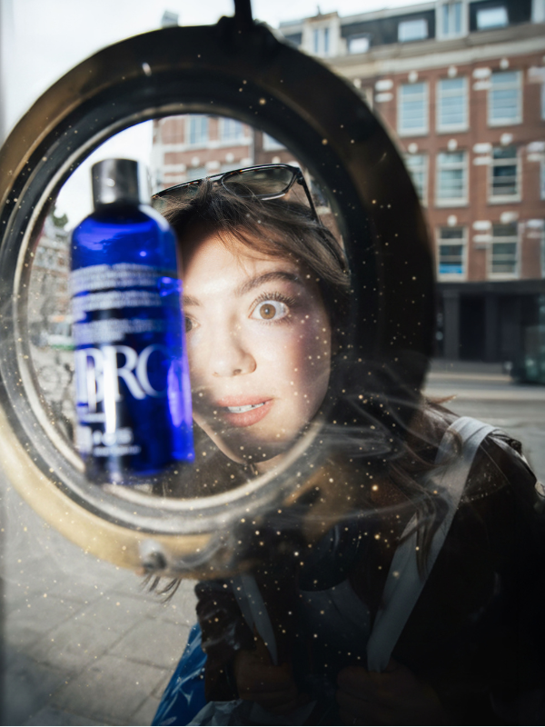 woman looking at bottle